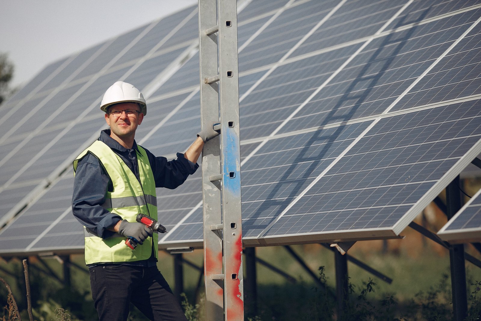 man with white helmet near sosslar panel scaled